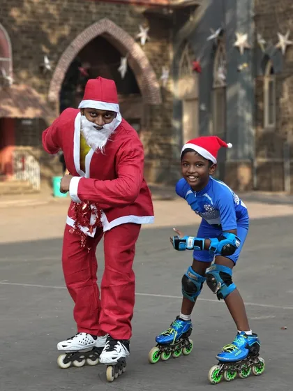 Santa showing off his moves with one of our young skaters. Our events are fun for coaches and students alike.