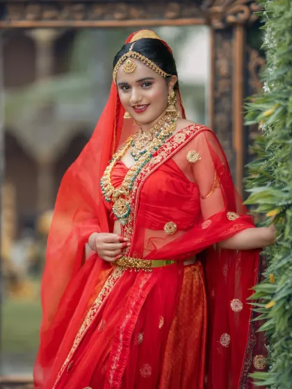 The full bridal look, complete with a sheer dupatta and beautiful jewellery.