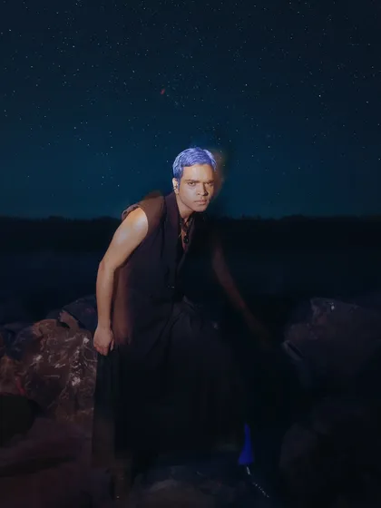 An artistic shot from an editorial project where I handled men's grooming. The concept involved creating a futuristic look with bold, temporary blue hair color that stands out against the dark, atmospheric background.