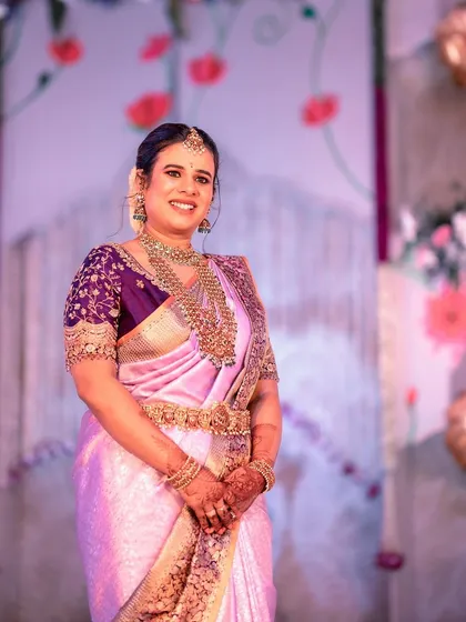 A full-length shot of the client at the naming ceremony, showing the complete, elegant ensemble.
