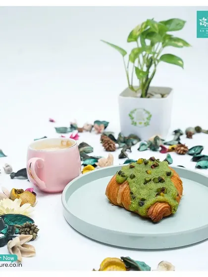 Our Pistachio Croissant is a delightful twist on a classic. It’s a flaky butter croissant filled with rich pistachio cream and topped with more pistachios for a nutty, satisfying crunch.