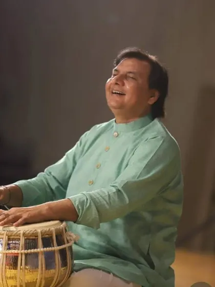 A photograph from a performance, shared on the auspicious occasion of Gurupurab with blessings for peace and happiness to all.