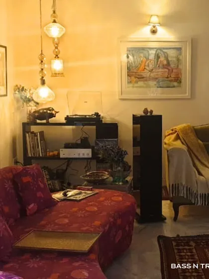 There's a unique warmth to vinyl that digital can't replicate. This cozy living room setup, featuring Piega speakers and an Audio Technica turntable, is the perfect setting for an evening of analog romance.