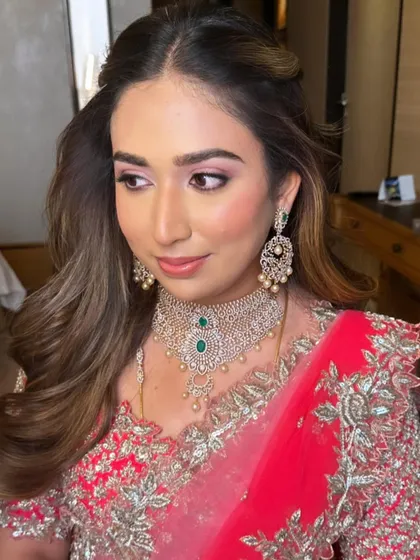 Soft, elegant, and timeless. This reception look features a wash of pink on the eyes and glowing skin, creating a romantic and feminine feel.