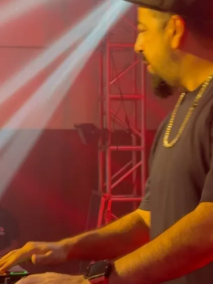 A close-up shot of me mixing during a high-energy college fest set.