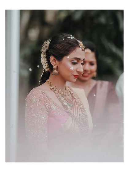 A beautiful, soft-focus portrait of the bride during her ceremony, her expression serene and thoughtful.