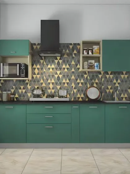 A straight-line kitchen design featuring green cabinets and a striking geometric-patterned backsplash. We included open shelving and a built-in microwave niche to ensure the space is both stylish and highly functional.