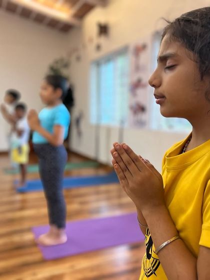 Each child progresses at their own pace. The goal is not perfection, but consistency. This young girl is learning to find her center through the vibration of the chants. This is how we build a strong spiritual family from a young age.