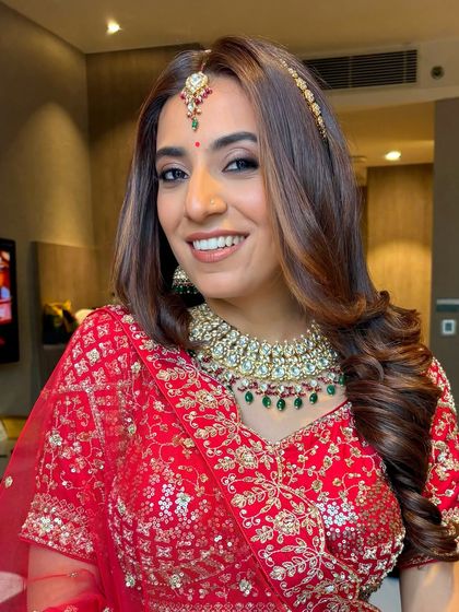 This bride's striking features are the star. The makeup enhances her natural beauty, with a focus on the eyes and a flawless base.