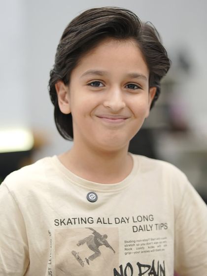 He's all smiles with his new haircut. We love having clients of all ages in the salon.
