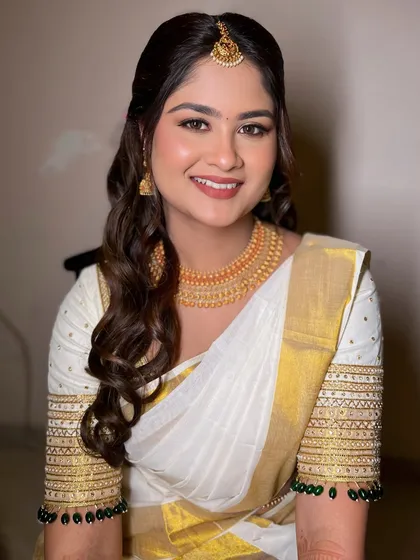 This is my signature 'minimal magic' style. For my beautiful South Indian bride Kirthana, we created a soft, glowing look that felt fresh, timeless, and completely her. Her smile says it all.