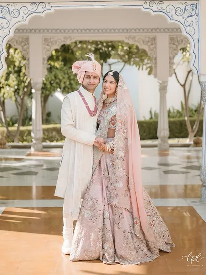 A classic couple portrait within the arched corridors of a palace. These are the timeless images that tell the story of your royal celebration for years to come.