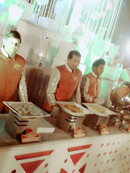 Our staff in traditional jackets, ready to serve at a wedding event. Their professional appearance adds to the overall quality of the experience.