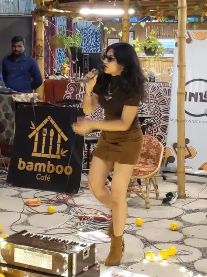 Performing an acoustic set at a cozy cafe event. This photo shows the intimate and casual setup, perfect for smaller venues and audiences who want to connect with the music.
