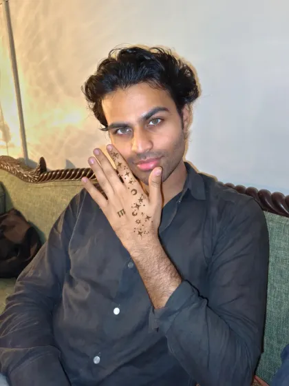 Mehndi isn't just for the ladies. Here's a cool, minimalist celestial design with stars, moons, and an angel number for a male client.