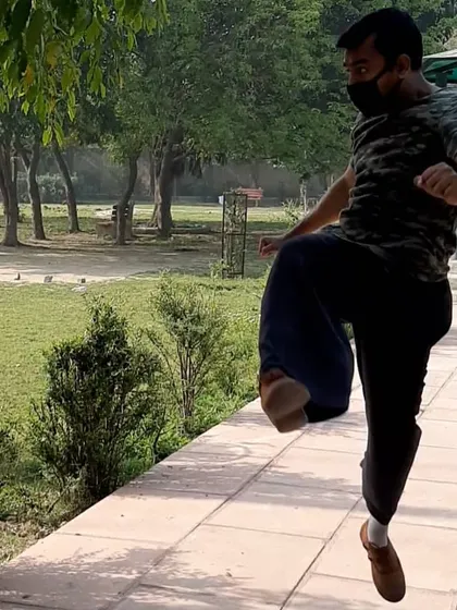 I believe in leading by example. Here I am executing a jump kick, a dynamic move that combines power, agility, and timing. I teach my students the step-by-step progressions to safely build up to advanced techniques like this.