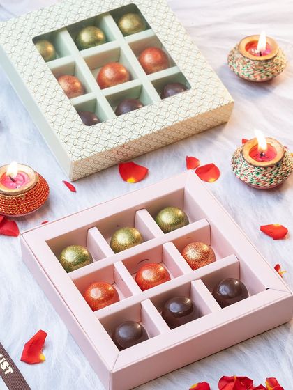 Our exclusive Raksha Bandhan gift hampers, featuring boxes of assorted, colourful bonbons. A sweet and elegant gift to celebrate the sibling bond.