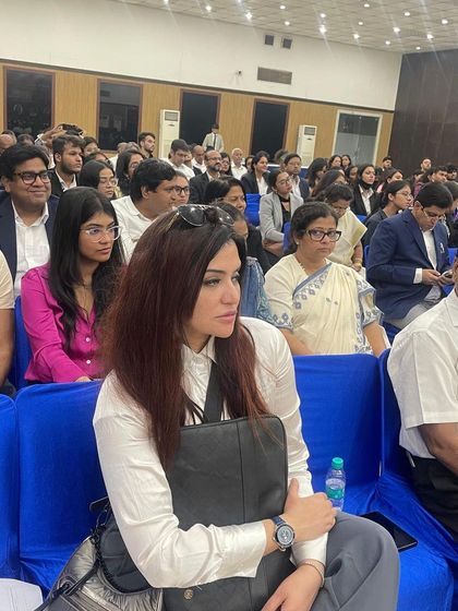 Listening intently during the panel discussion on women in law. These conversations are crucial for promoting a balanced approach to equality in the legal profession.