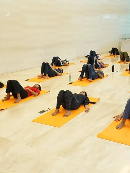 An instructor guiding ONGC employees through a relaxation technique. These sessions are designed to provide a complete reset, helping participants release accumulated stress and return to their work with renewed focus.