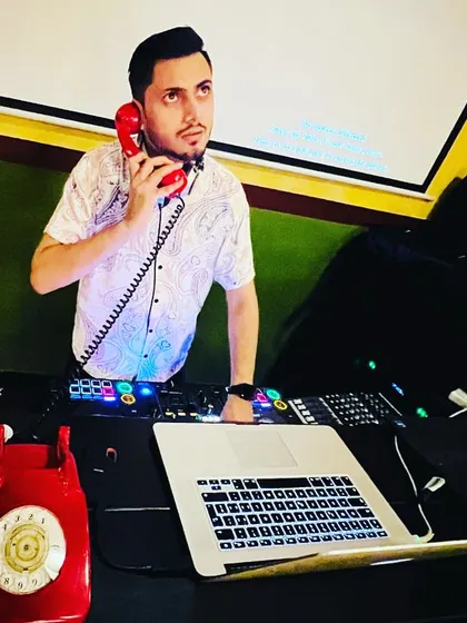 Someone's on the line with a song request. At my gigs, I'm always connected to the crowd's vibe, whether it's through the music or a retro telephone.