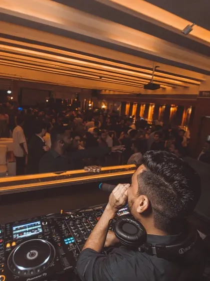 Grabbing the mic to hype up the crowd is a key part of my performance style. It helps build a direct connection and boosts the party atmosphere.