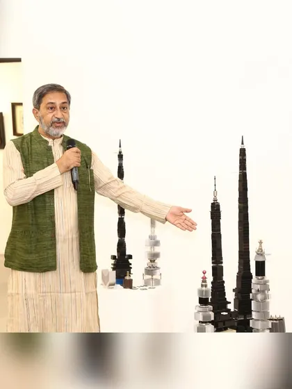 Speaking at my exhibition, explaining the stories behind the "Future City" skyscrapers made from discarded electronics.