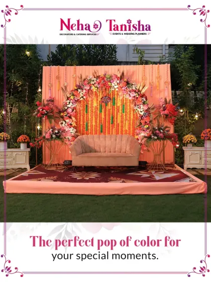 A perfect pop of color for your special moments. This cozy yet stunning outdoor stage, with its peach-toned backdrop and vibrant floral arch, is ideal for an intimate engagement or pre-wedding function.