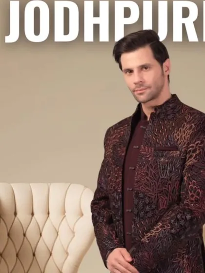 Here is a fine example of our Jodhpuri suits. This piece has a rich, patterned fabric that gives it a very regal feel, perfect for a wedding guest or for a sangeet ceremony. It’s a fusion style that is both traditional and fashionable.