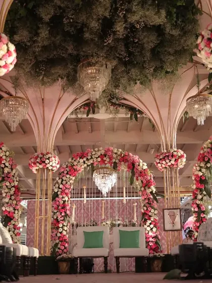 Transforming a ferry into a wedding venue requires careful planning. We designed this elegant mandap on the deck, complete with floral pillars and chandeliers, for a wedding on the water.