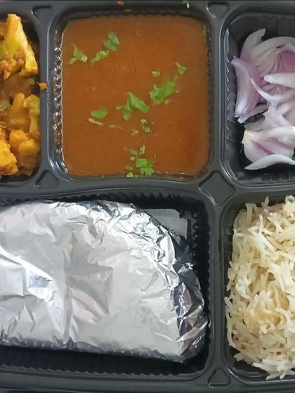 Another look at the classic rajma and aloo gobhi thali. The side of pickled onions adds a nice crunch and tang to the meal.