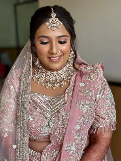 Another angle with eyes closed, highlighting the flawless eyeshadow blending and the natural-looking lashes.