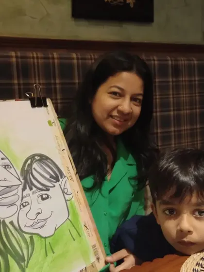 A mother and son with their family caricature.