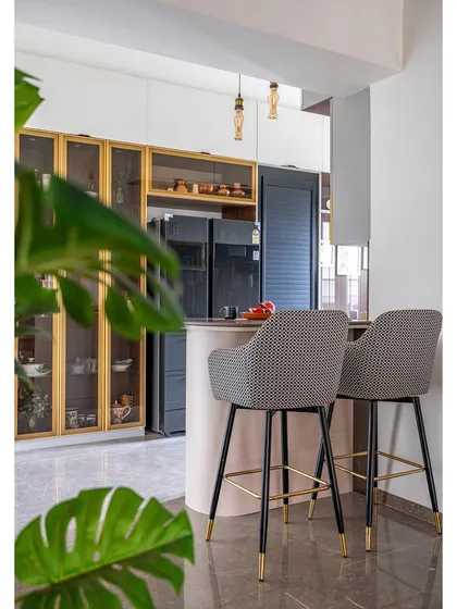 A view from the kitchen towards the breakfast bar, a perfect spot for casual meals or morning coffee. The design ensures the cook can always be part of the conversation.
