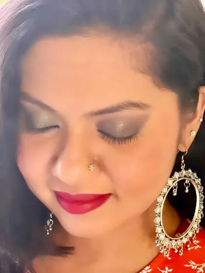 This close-up shows the beautiful texture of the smokey eyeshadow. The subtle shimmer adds dimension, creating a look that is both dramatic and sophisticated for an evening out.