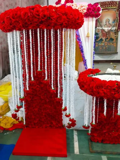 For a truly royal welcome for Bappa, I design elaborate thrones like this one, using dense red florals and contrasting white strings.