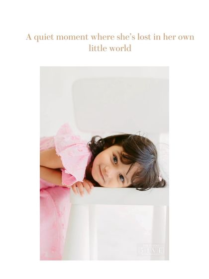 A quiet, contemplative moment as she rests her head on the chair. A child's portrait session can capture a whole range of moods, from energetic to soulful.