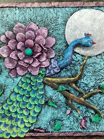 A colorful relief mural of a peacock under the moon, adorned with a large flower. This piece combines sculpting with painting techniques.