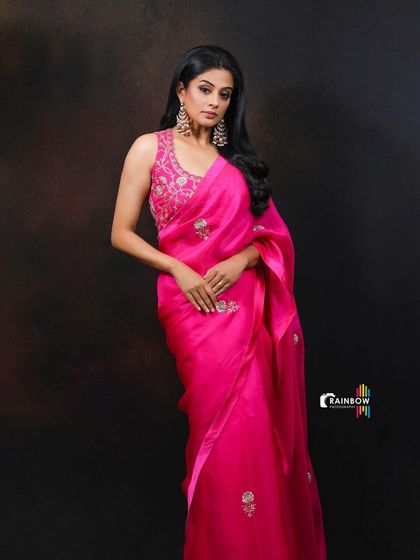 This portrait of Priyamani captures her classic beauty. The lighting is carefully controlled to highlight her features and the texture of the saree.