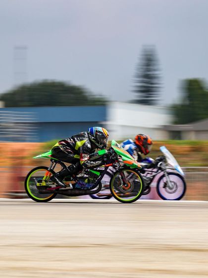 Two custom-built drag bikes, stripped down to the bare essentials for weight reduction, race neck-and-neck.