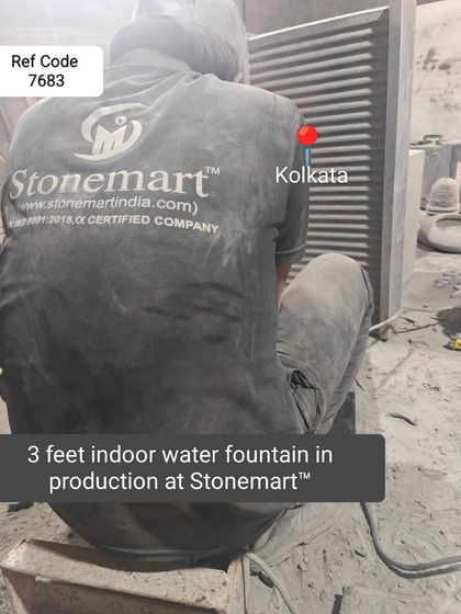 An artisan works on a 3-foot indoor water fountain in production at my workshop.