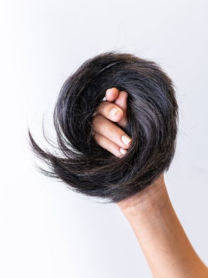 This is the Donut Bun extension, made from 100% real human hair. It's the secret to creating a full, perfectly shaped bun, whether you want a sleek or messy style.