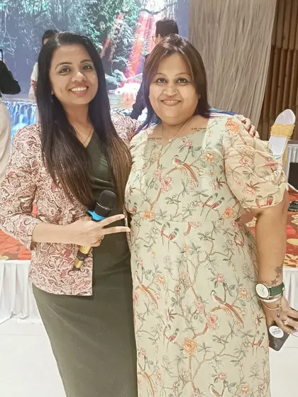 With a happy client at a 70th birthday bash I hosted. The event was a huge success with an unplugged band, fun games, and a DJ night.