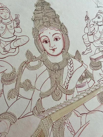 Mysore paintings are renowned for their captivating facial features. This close-up of Goddess Saraswathi shows how we infuse each artwork with beautiful and nuanced expressions for a timeless appeal.