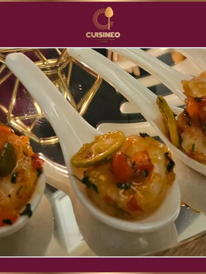 An elegant appetizer served on a tasting spoon. This style of presentation is perfect for sophisticated cocktail events, allowing guests to sample a variety of our gourmet creations with ease.