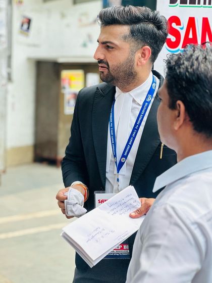 Listening intently to a colleague. Every perspective is valuable.