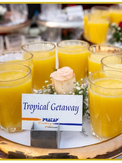 Escape to paradise with our "Tropical Getaway" mocktail. This sunny yellow drink is a sweet and refreshing blend of exotic fruit flavors.