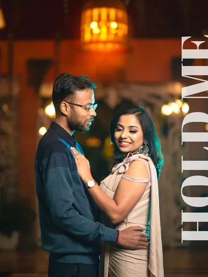 Using the warm, ambient lighting of a resort at night to create a romantic and elegant portrait. The soft glow on Akash and Priya's faces highlights their connection in this beautifully composed evening shot.