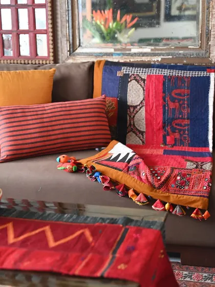 Another view of the scrap quilt, showing how the different patches of fabric, from Ajrakh prints to simple checks, come together to form a cohesive whole.