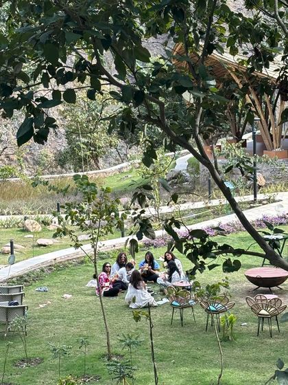 A wide view of our women's circle, enjoying a moment of connection on the lush lawns of the retreat center. The expansive space allows for both community gathering and personal reflection.