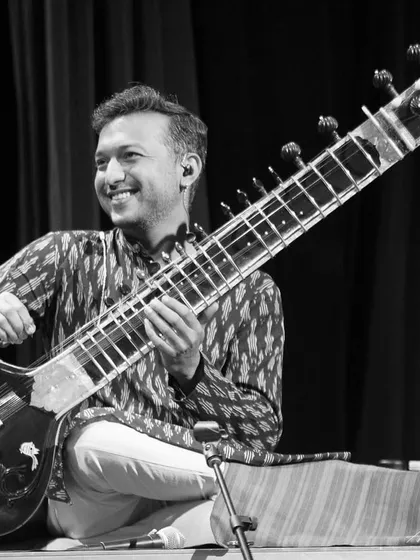 With my forever trusted companion, my Sitar. This photo was taken during our show at UCLA, a moment of good vibes and great music.